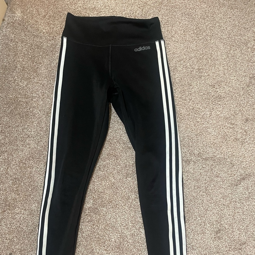 Beautiful Adidas leggings. Black with white stripes.